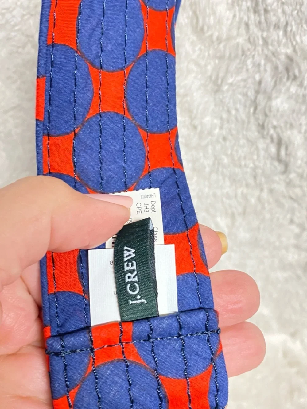 J. Crew Quilted Wrist Strap in Navy and Bright Orange Circle Print - Picture 2 of 5